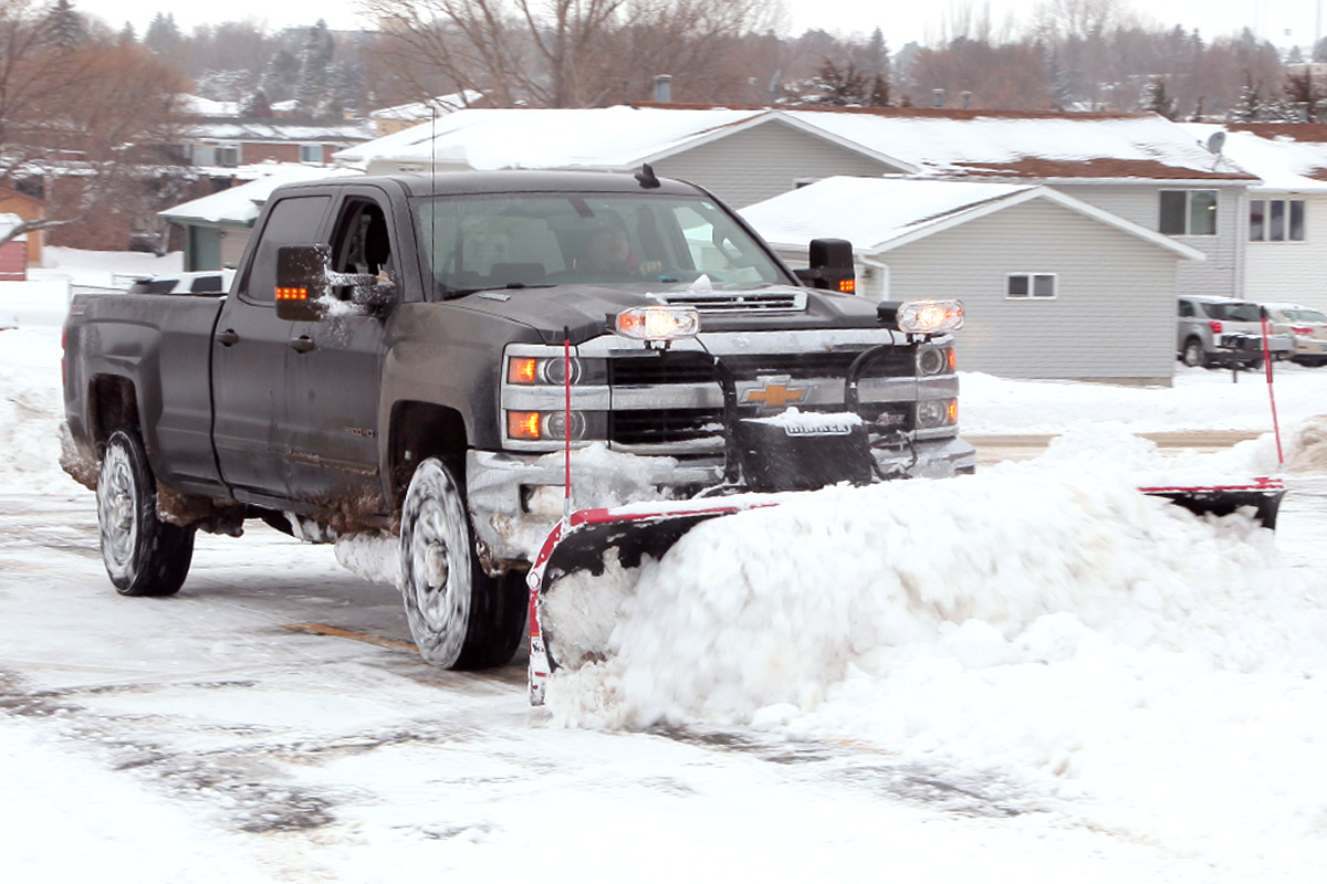 Pushing and clearing snow with a pickup
